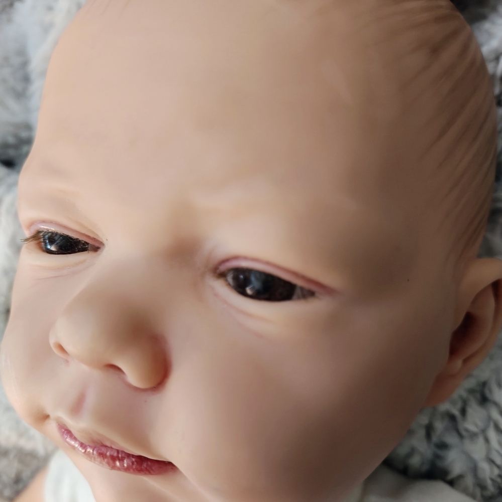 Realistic Baby Doll in Car Print Onesie